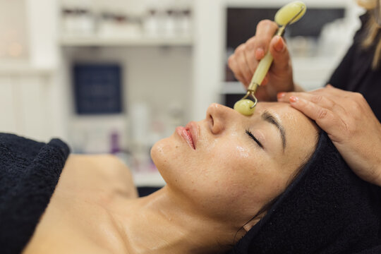 skin treatment with gua sha tool
