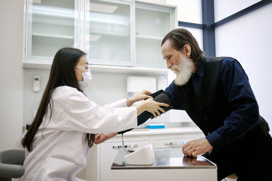 Mature man receiving medical care in hospital 