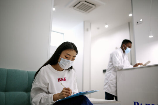 Woman registering on vaccination in medical centre 