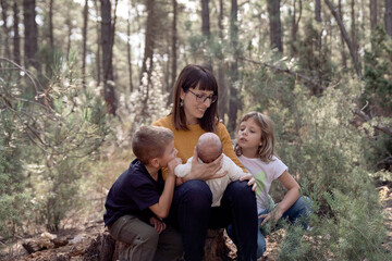 Mother with her three sons outdoors