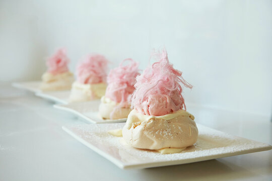 A row of Meringue with Rose Ice cream and Persian fairy floss