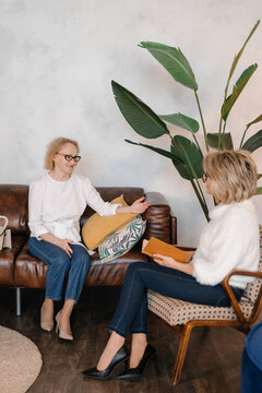 Senior woman speaking with psychologist