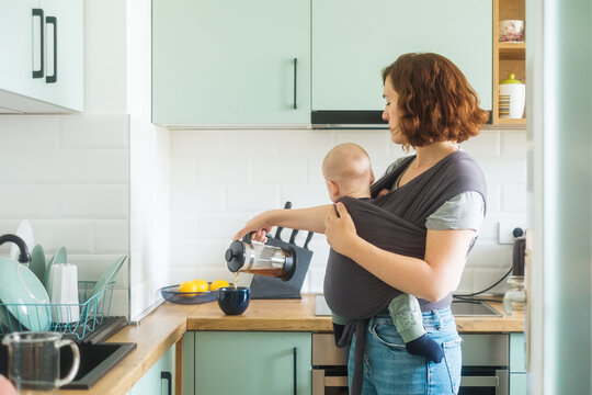 Woman Making Coffee In The Kitchen
