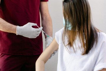 A Woman Receives the COVID Vaccine