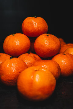 tangerines on a black background