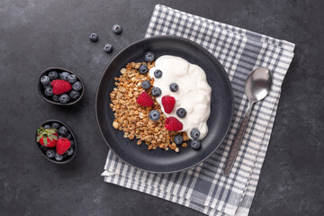 Healthy breakfast with baked granola and greek yogurt.
