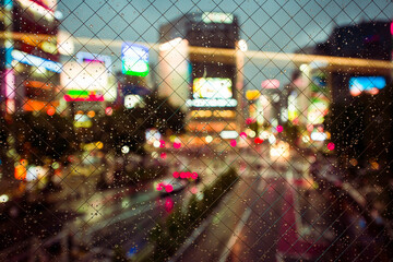 Grid and water drops with cityscape at night