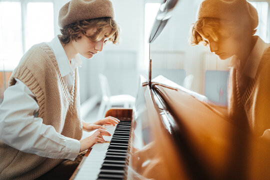 Vintage young woman playing piano