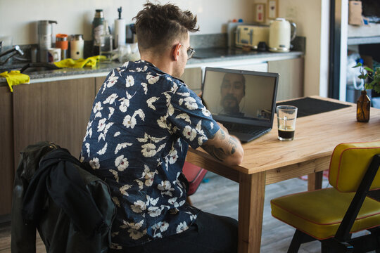 Man using technology to keep up with friends