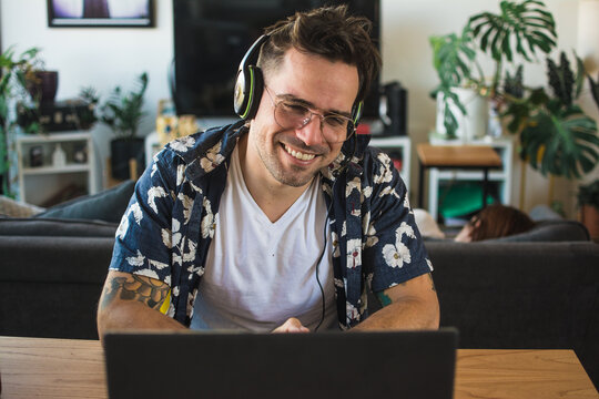 Happy man video calling a friend