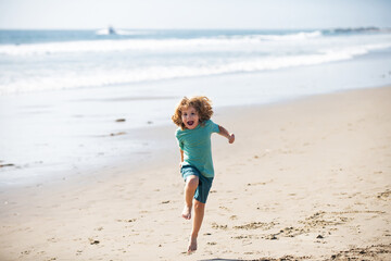 Fototapeta na wymiar Child boy running and jumping in summer sandy beach.