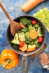 cooking vegetable stew in a saucepan