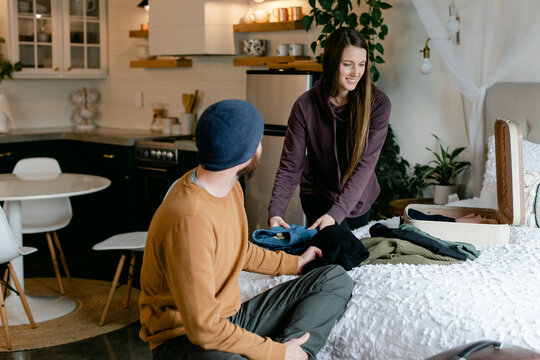 A Couple Packs Their Suitcase for Travel