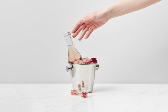 Girl taking bottle from ice bucket