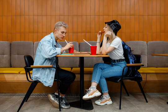 Young couple having lunch in cafe