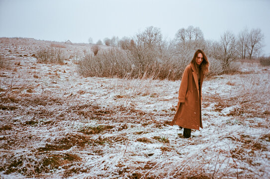 Woman in a field covered with snow