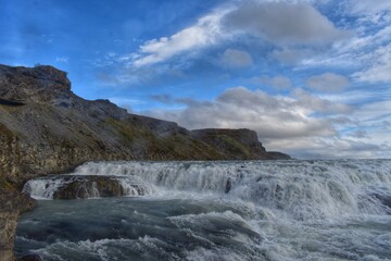 Mossy Rocks Overlook Icelandic Waterfall