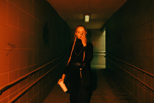 Young woman flashed with red light - Powered by Adobe