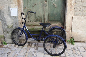 Fototapeta na wymiar Tricycle in the Croatian fishing port of Rovinj.