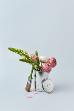 Tin of paint with peonies