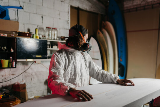 Young man working at his workshop