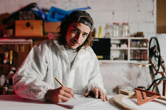 Young man working at his workshop