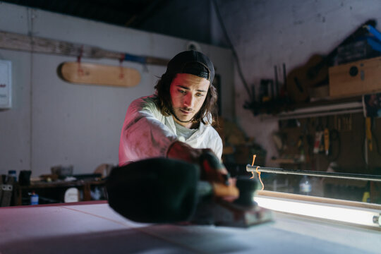 Young man working at his workshop