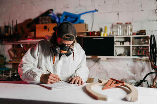 Young man working at his workshop