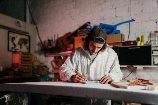 Young man working at his workshop