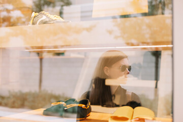 Woman reflection in shop window store