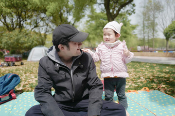 Two year old babygirl playing in the park with father,Shanghai,Asia