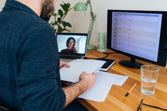 Young adult man having a business video call conversation 