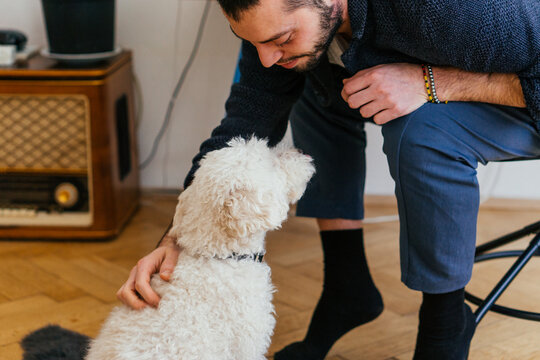 Man patting his dog firend