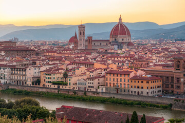 Obraz premium Florence, Italy -20 June, 2019 : panoramic sunset view of Cathedral of Santa Maria del Fiore, known for its red-tiled dome, picture was taken from Piazzale Michelangelo.