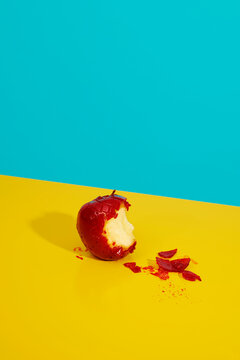 nibbled candy apple on a table
