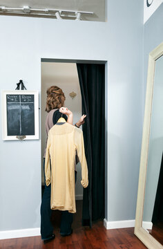 Boutique: WomanTakes Blouse Into Fitting Room