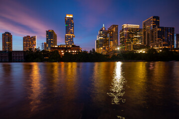Fototapeta na wymiar Austin Texas skyline cityscape downtown. USA Austin city. Night sunset city. Reflection in water.
