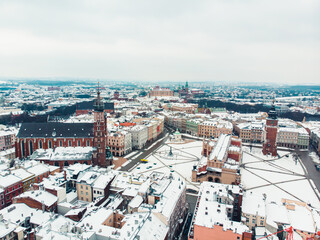 Panoramic view of the Main Square in Krakow, Poland surrounded by historic townhouses (kamienice)...