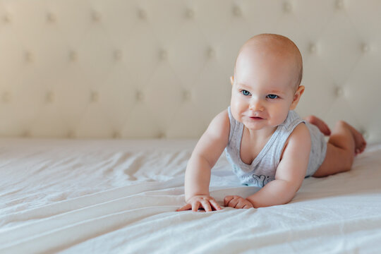 Happy baby practices crawling
