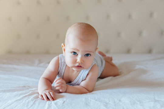 Male baby lying on the bed