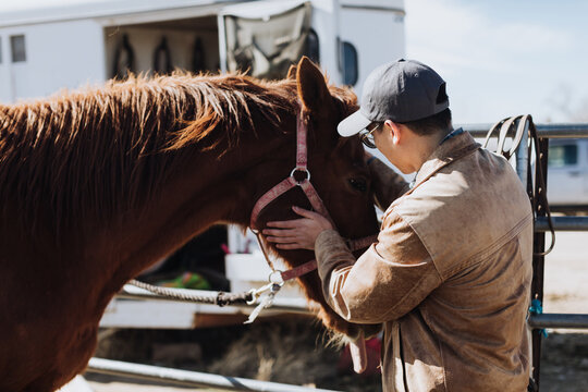 Rancher Pets Horse