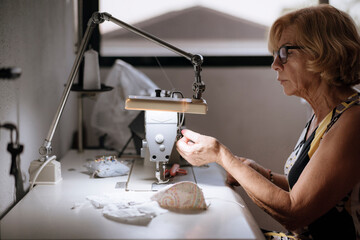 Adult tailor sewing masks, handmade work