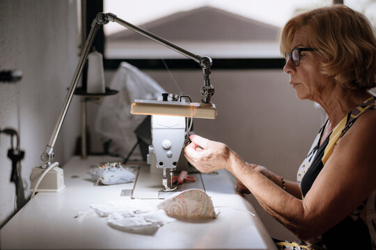 Adult tailor sewing masks, handmade work