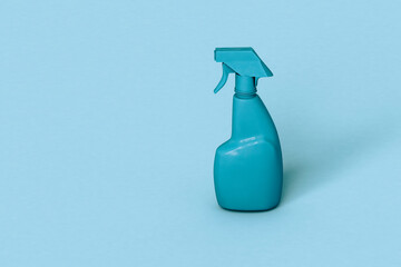 one Blue spray bottle on blue