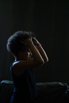 Girl runs hands through afro
