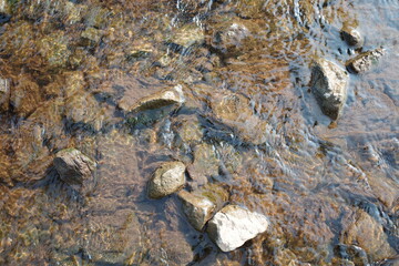 The water in the stream flowing through the rocks