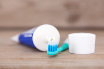 A tube of toothpaste and a toothbrush