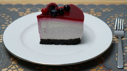 piece of raspberry cheesecake with berries