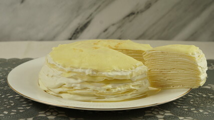 vanilla crepe cake on white plate