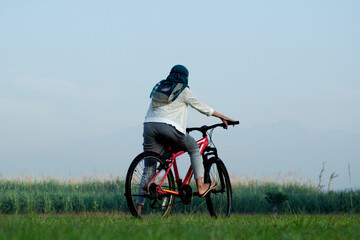 Fototapeta premium person riding a bike